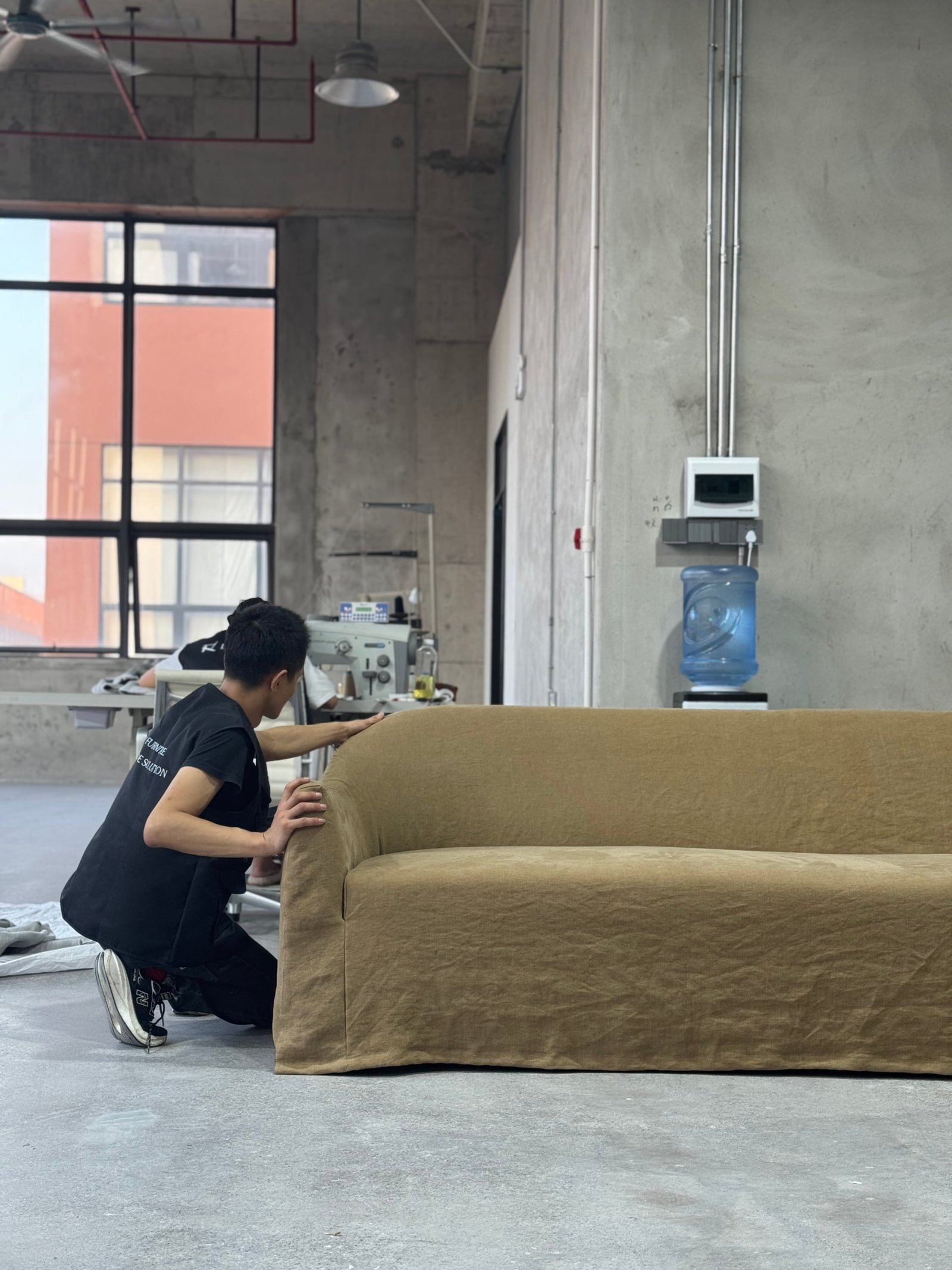 Linen World atelier -- premium handcrafted linen furniture in production